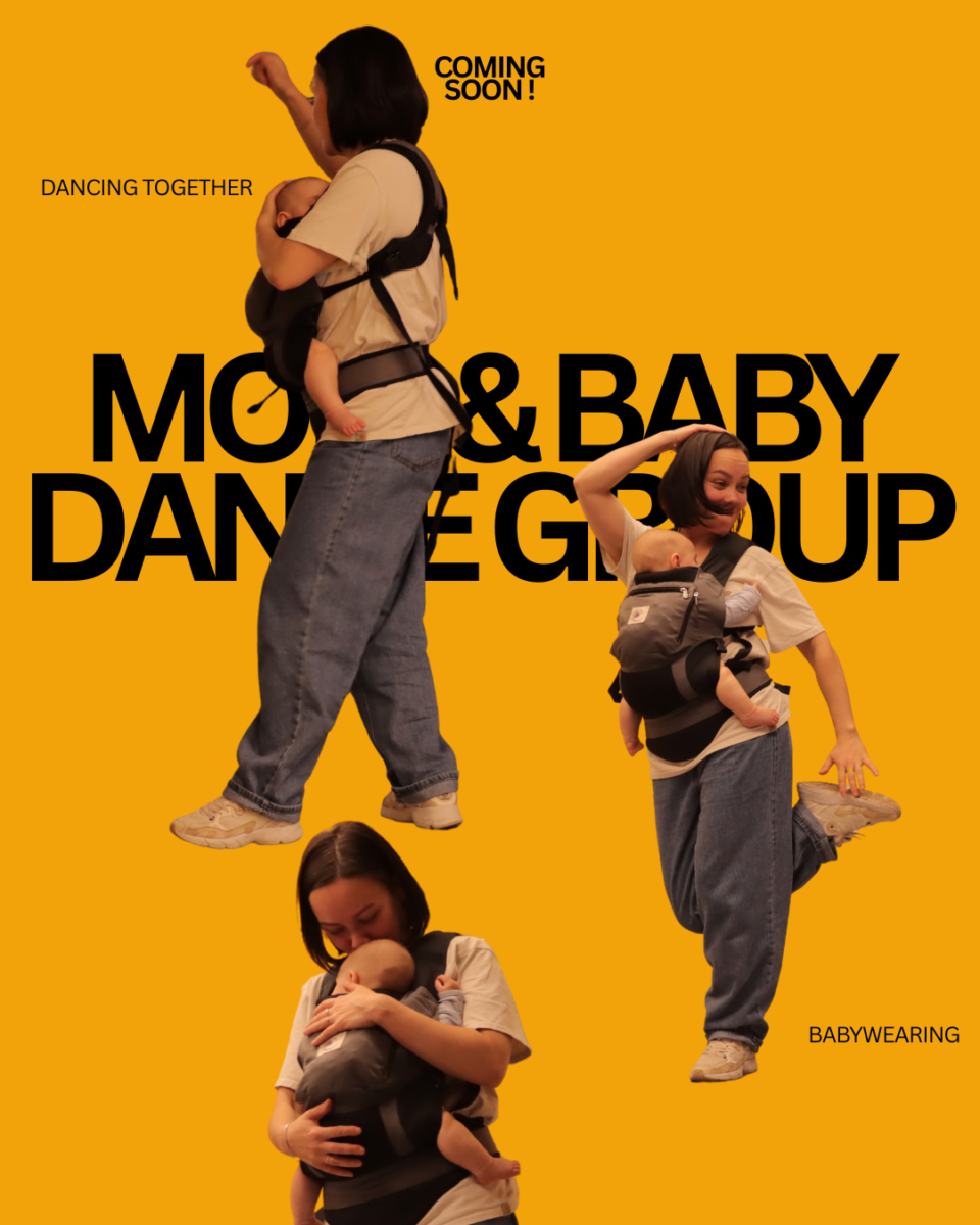 Mom dancing with baby in a sling during a parent and baby dance class in Whitehorse